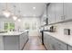 Bright kitchen with stainless steel appliances, spacious countertops, and stylish fixtures at 217 Braeburn Dr, Graham, NC 27253