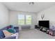 Comfortable living room with plush seating, bright windows, and a relaxing atmosphere at 217 Braeburn Dr, Graham, NC 27253