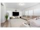 Spacious living room with neutral decor, large sectional sofa, and bright, natural light at 217 Braeburn Dr, Graham, NC 27253