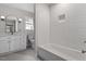 This renovated bathroom boasts a tub, a vanity, and new fixtures at 2225 Whitley Dr, Durham, NC 27707
