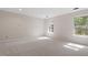 Bedroom with carpeted floors and bright natural lighting at 2225 Whitley Dr, Durham, NC 27707