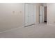 This bedroom features neutral walls and carpet, and a large closet for ample storage at 2225 Whitley Dr, Durham, NC 27707