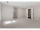 This bedroom features neutral walls and carpet, and two closets for ample storage at 2225 Whitley Dr, Durham, NC 27707