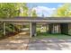 Spacious covered carport and adjoining patio area, perfect for outdoor living and entertaining at 2225 Whitley Dr, Durham, NC 27707