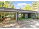 Covered carport with adjacent flexible outdoor space, blending functionality with style at 2225 Whitley Dr, Durham, NC 27707