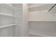 This walk-in closet features shelving for easy organization and additional storage space at 2225 Whitley Dr, Durham, NC 27707