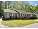 Inviting single-story home with a lush lawn, well-manicured landscaping, and charming exterior at 2225 Whitley Dr, Durham, NC 27707