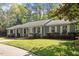 Beautiful single-story home with a well-kept lawn, mature trees, and welcoming curb appeal at 2225 Whitley Dr, Durham, NC 27707