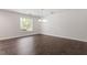 Spacious living room with hardwood floors, white walls, and natural light creates a bright and inviting space at 2225 Whitley Dr, Durham, NC 27707