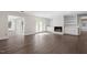 Spacious living room with fireplace, built-in shelving, and hardwood floors at 2225 Whitley Dr, Durham, NC 27707