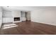 Bright living room with fireplace and built-in shelves and hardwood floors at 2225 Whitley Dr, Durham, NC 27707