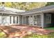 Brick patio with sliding glass doors, seamlessly blending indoor and outdoor living spaces at 2225 Whitley Dr, Durham, NC 27707