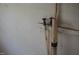 Close up of the wall and the water valves at 223 Gum Ave, Spring Hope, NC 27882