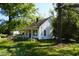 Exterior of home with a small porch, roof and yard with trees at 223 Gum Ave, Spring Hope, NC 27882