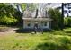 Exterior of home with a small porch, roof and yard with trees at 223 Gum Ave, Spring Hope, NC 27882