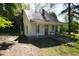 Exterior of home with a small porch, roof and yard with trees at 223 Gum Ave, Spring Hope, NC 27882