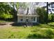 Exterior of home with a small porch, roof and yard with trees at 223 Gum Ave, Spring Hope, NC 27882