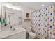 Bathroom featuring a white vanity, triangle-patterned shower curtain, mirror, and toilet at 226 Marquis Dr, Cameron, NC 28326