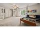 Spacious bonus room with a large window, play equipment, and a cozy sofa, perfect for Gathering activities at 226 Marquis Dr, Cameron, NC 28326