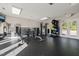 Community fitness center featuring weights, various weight machines, and double doors leading to the exterior at 226 Marquis Dr, Cameron, NC 28326