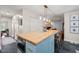 Kitchen island featuring butcher block countertop, stainless steel oven, bar stools, and pendant lighting at 226 Marquis Dr, Cameron, NC 28326