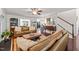 Spacious living room featuring hardwood floors, comfortable seating, and an open layout perfect for entertaining and relaxation at 226 Marquis Dr, Cameron, NC 28326
