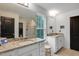 Granite countertops, white cabinets, and modern fixtures define the stylish primary bathroom at 2283 Grants Pass Sta, Apex, NC 27502