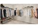 Walk-in closet featuring ample storage for shoes, shirts, and accessories at 2283 Grants Pass Sta, Apex, NC 27502