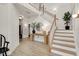 Inviting foyer with a staircase and decorative table at 2283 Grants Pass Sta, Apex, NC 27502