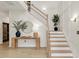 Spacious foyer featuring hardwood floors and a staircase at 2283 Grants Pass Sta, Apex, NC 27502