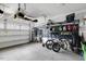 Spacious garage with organized storage, including overhead racks, wall-mounted equipment, and multiple bicycles, maximizing space at 2283 Grants Pass Sta, Apex, NC 27502