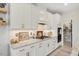 Beautiful kitchen featuring white cabinets, stainless appliances, granite countertops, and a convenient layout with a pantry at 2283 Grants Pass Sta, Apex, NC 27502