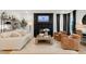 Bright living room featuring a fireplace, modern decor, and comfortable seating at 2283 Grants Pass Sta, Apex, NC 27502