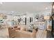 Open-concept living space with modern decor, comfortable seating, and a view into the kitchen area at 2283 Grants Pass Sta, Apex, NC 27502