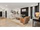 Bright living room featuring a fireplace, modern decor, and comfortable seating at 2283 Grants Pass Sta, Apex, NC 27502