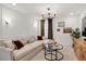 Cozy living room with modern decor, a comfortable sectional sofa, and a glass table at 2283 Grants Pass Sta, Apex, NC 27502