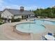 A community pool with a zero-entry splash pad and plenty of seating for lounging and socializing at 2283 Grants Pass Sta, Apex, NC 27502
