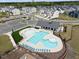 Aerial view of a community pool and amenity center with ample seating, a area, and parking at 2283 Grants Pass Sta, Apex, NC 27502
