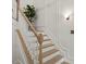 Elegant staircase with wood treads, white risers, and decorative wall trim at 2283 Grants Pass Sta, Apex, NC 27502