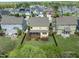 Aerial shot of a backyard with a screened porch and fenced yard at 233 Pointe Park Cir, Holly Springs, NC 27540