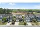 Aerial view of homes in a residential community, with construction in the background at 233 Pointe Park Cir, Holly Springs, NC 27540