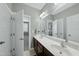 Bathroom featuring a double sink vanity with white countertops at 233 Pointe Park Cir, Holly Springs, NC 27540
