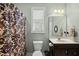 Bathroom featuring a single sink vanity and a shower with a patterned curtain at 233 Pointe Park Cir, Holly Springs, NC 27540