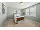Bedroom with a full bed, carpeted floors, and a sunny window at 233 Pointe Park Cir, Holly Springs, NC 27540