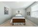 Bedroom with a full bed, carpeted floors, and a sunny window at 233 Pointe Park Cir, Holly Springs, NC 27540