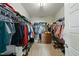 Large walk-in closet with ample storage, shelving, and hanging space at 233 Pointe Park Cir, Holly Springs, NC 27540