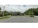 Charming community building with ample parking and well-manicured landscaping at 233 Pointe Park Cir, Holly Springs, NC 27540