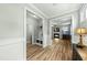 Entryway featuring a coat closet, mudroom area, and views into the living room at 233 Pointe Park Cir, Holly Springs, NC 27540