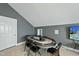 This game room is equipped with an oval poker table, seating, and a wall-mounted television set at 233 Pointe Park Cir, Holly Springs, NC 27540