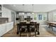 Modern kitchen with granite countertops, stainless steel appliances, and a central island at 233 Pointe Park Cir, Holly Springs, NC 27540